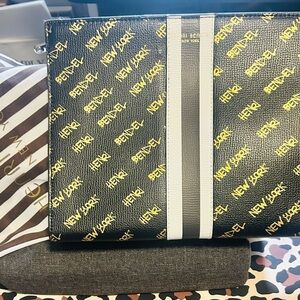 Henri Bendel Black Clutch gold signature design new with no tags & dust bag
